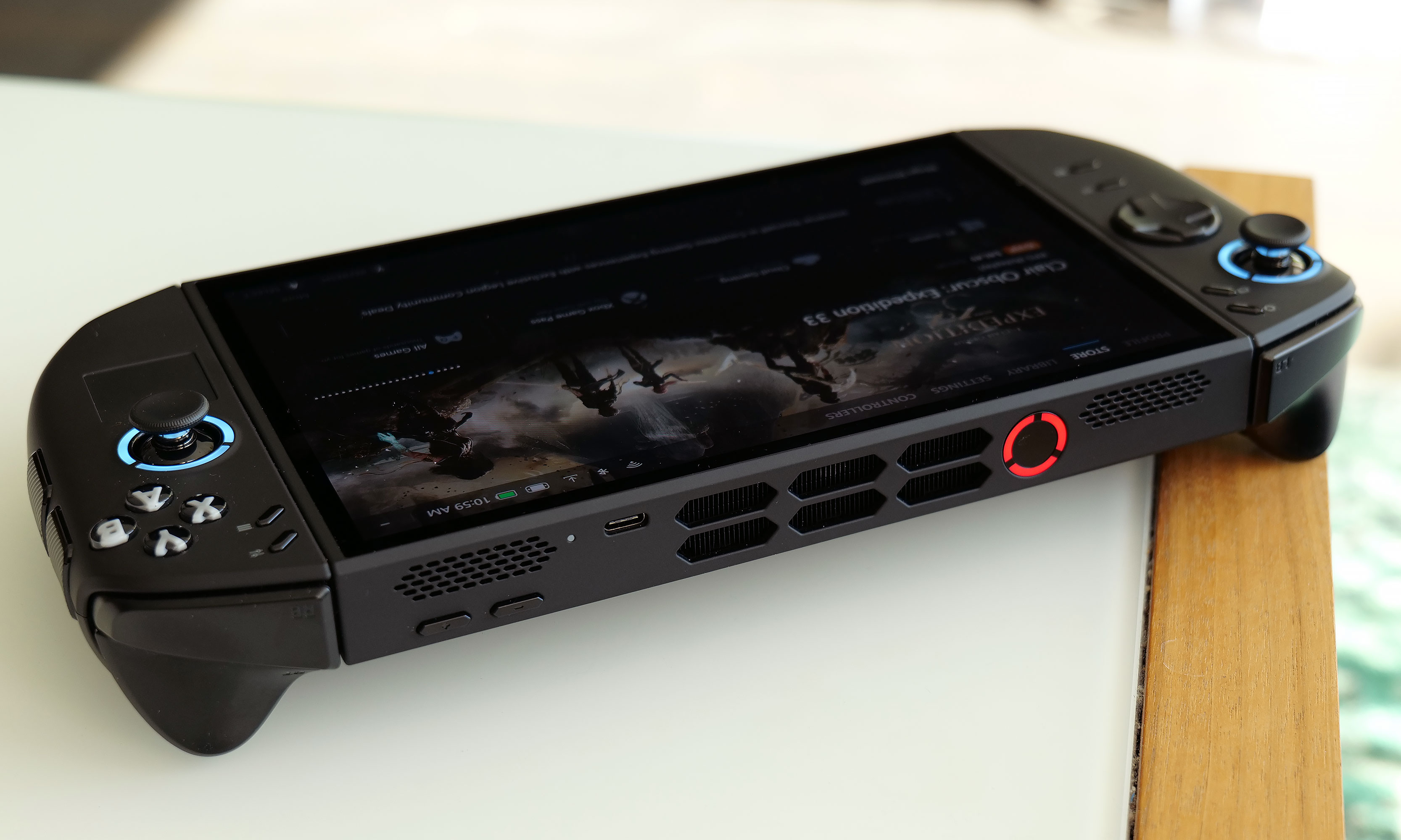 The top edge of the Legion Go 2 features one USB-C port and its power button/fingerprint reader, while the other is on the bottom along with a 3.5mm audio jack and a microSD card reader. 