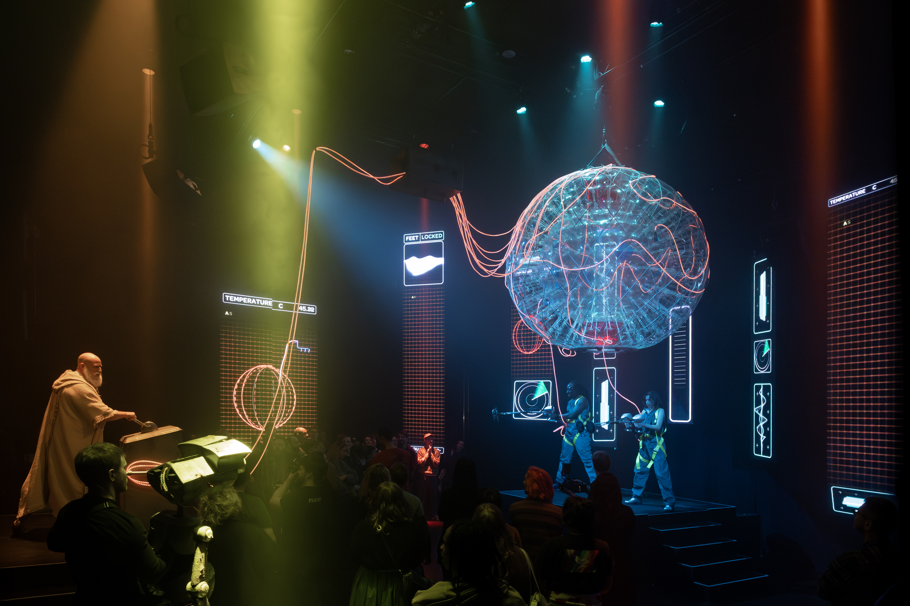 Slartibartfast (Richard Costello) holds court on the factory floor of Magrathea.