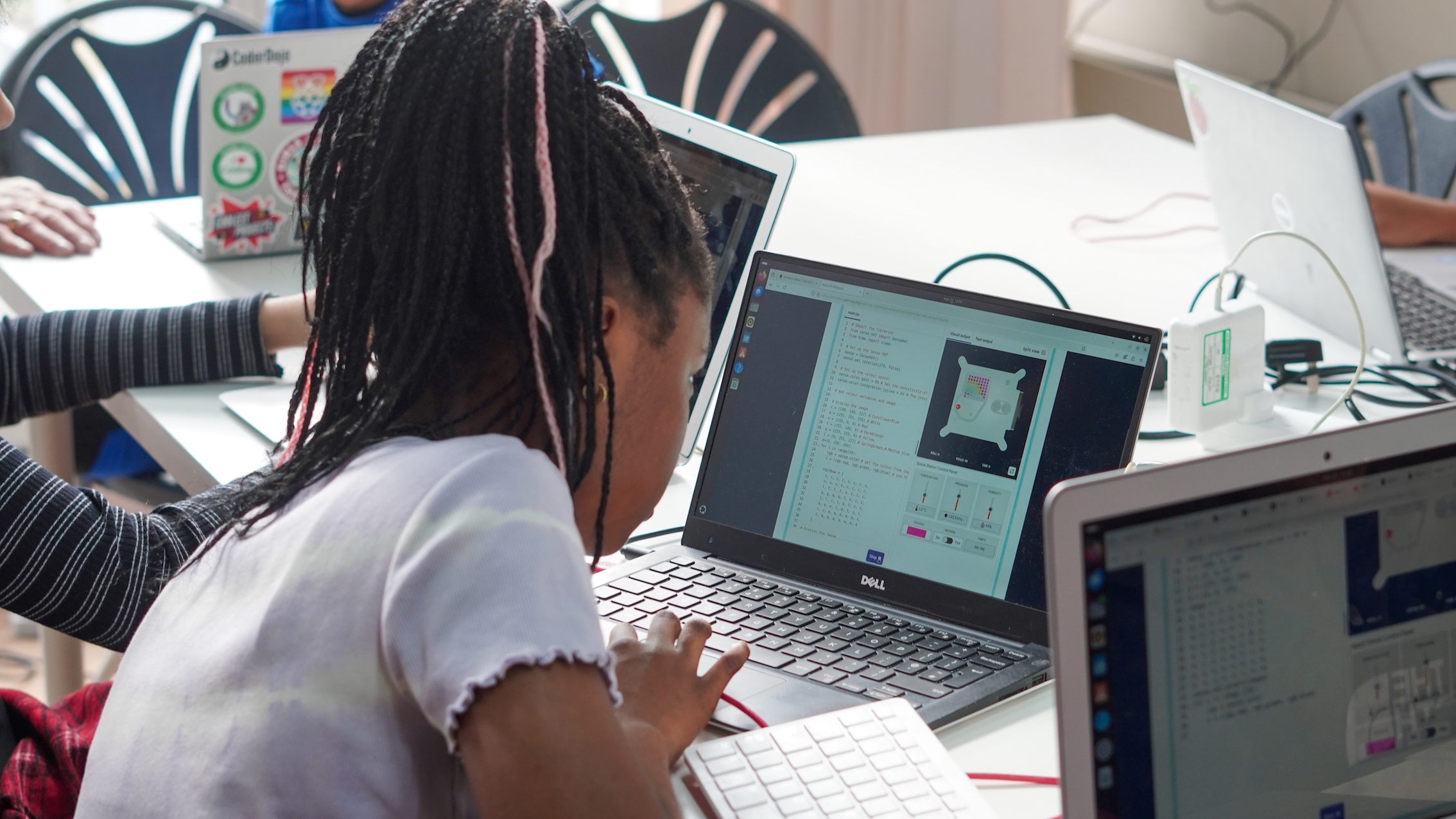 Young people writing Mission Zero programs.