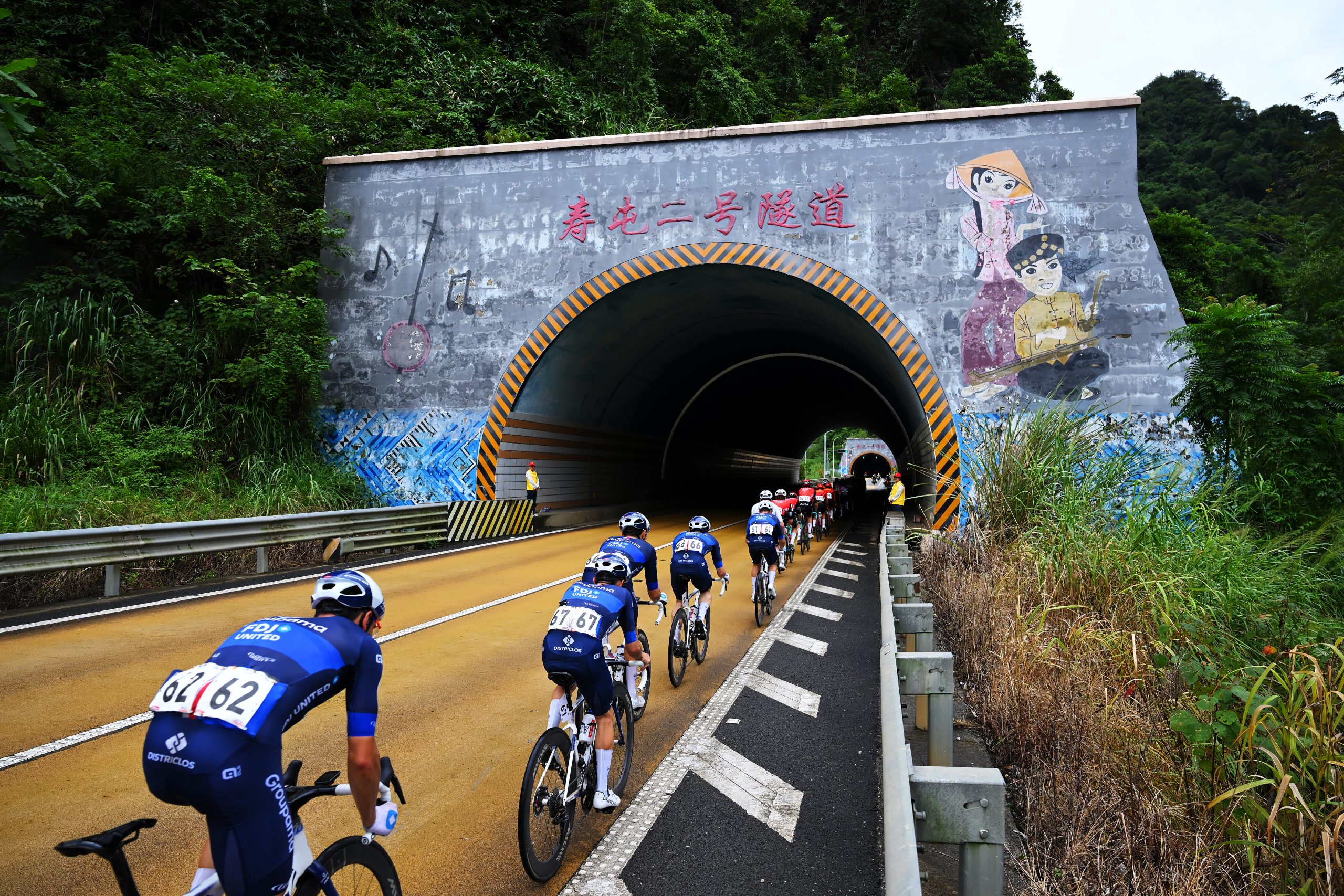 JINGXI, CHINA - OCTOBER 15: (L-R) Clement Davy of France, Remy Rochas of France and Team Groupama - FDJ and a general view of the peloton competing during the 6th Gree-Tour Of Guangxi 2025, Stage 2 a 178.9km stage from Chongzuo to Jingxi 741m on October 15, 2025 in Jingxi, China. (Photo by Tim de Waele/Getty Images)