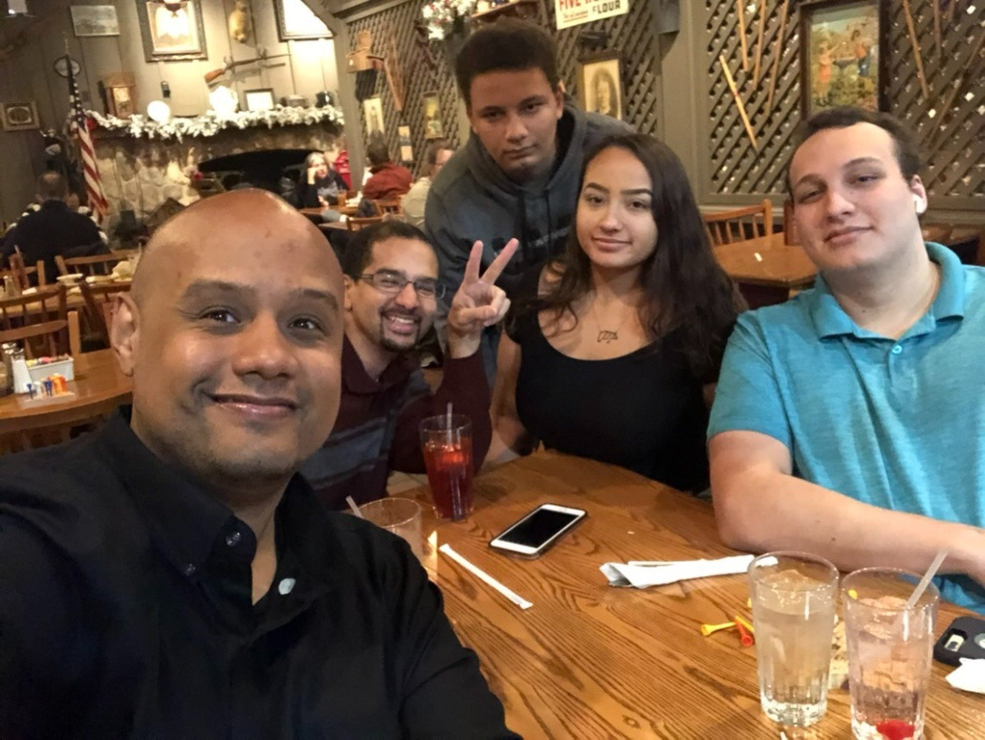 family sitting at table in restaurant