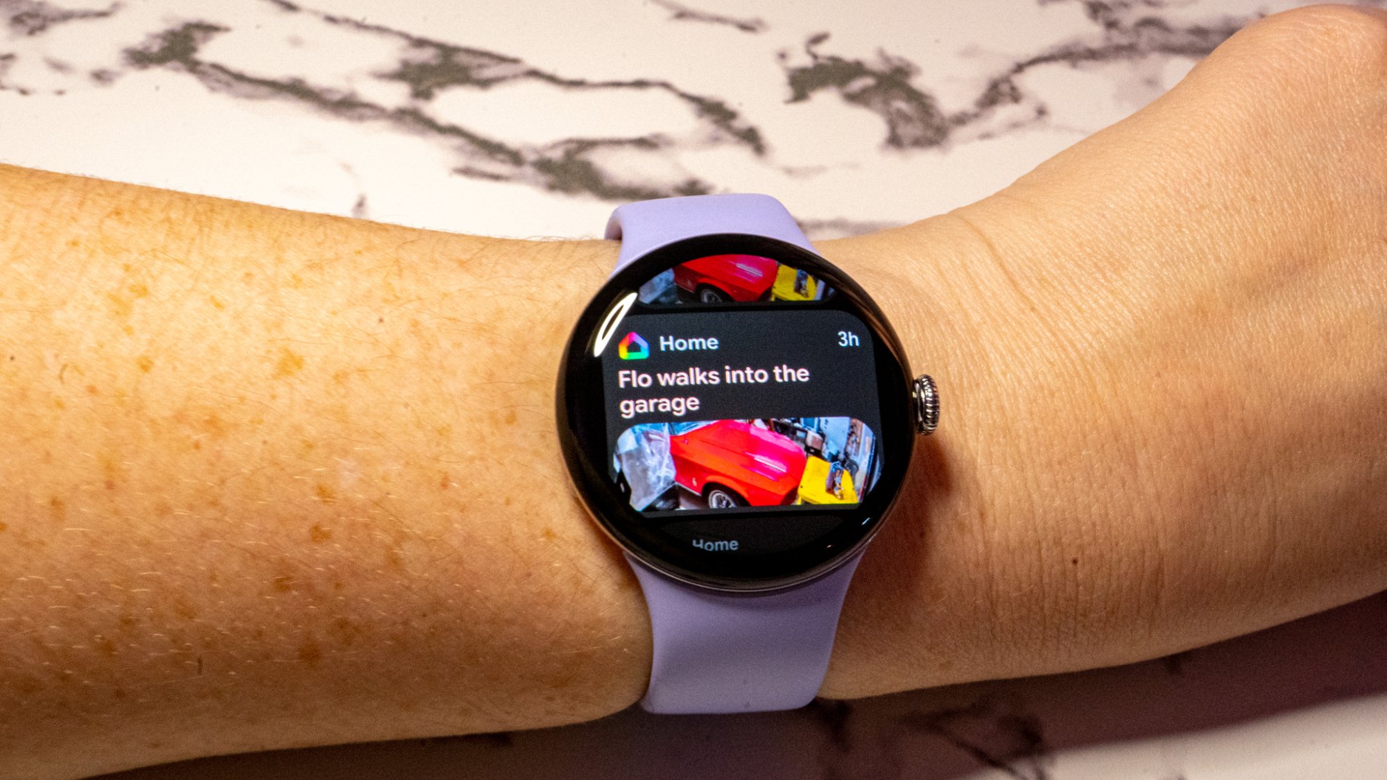 A photo of a Gemini-lef summary notification popping up on a Pixel Watch 4