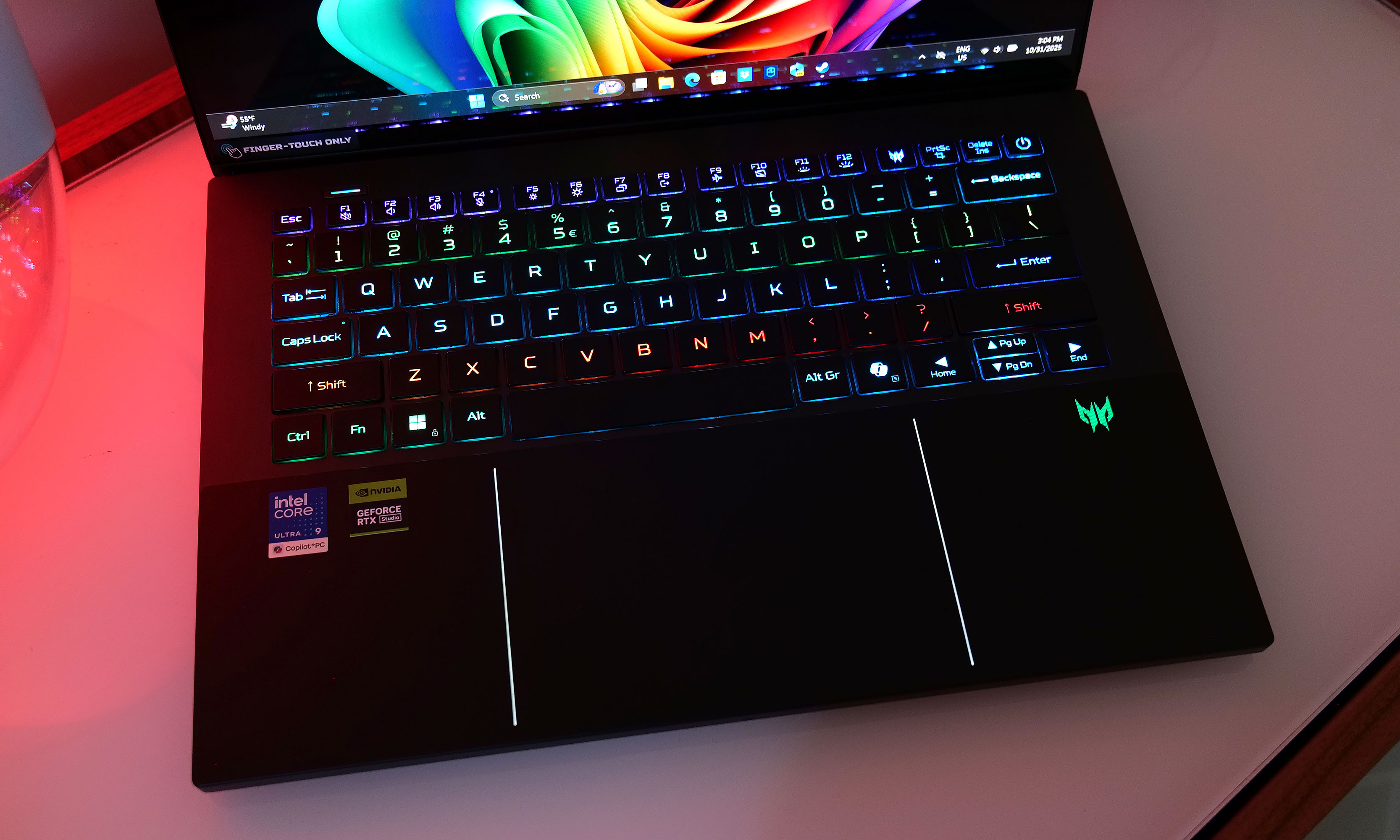 The Acer Predator Triton 14 AI features a keyboard with per-key mini LED lighting and a touchpad with built-in stylus support.