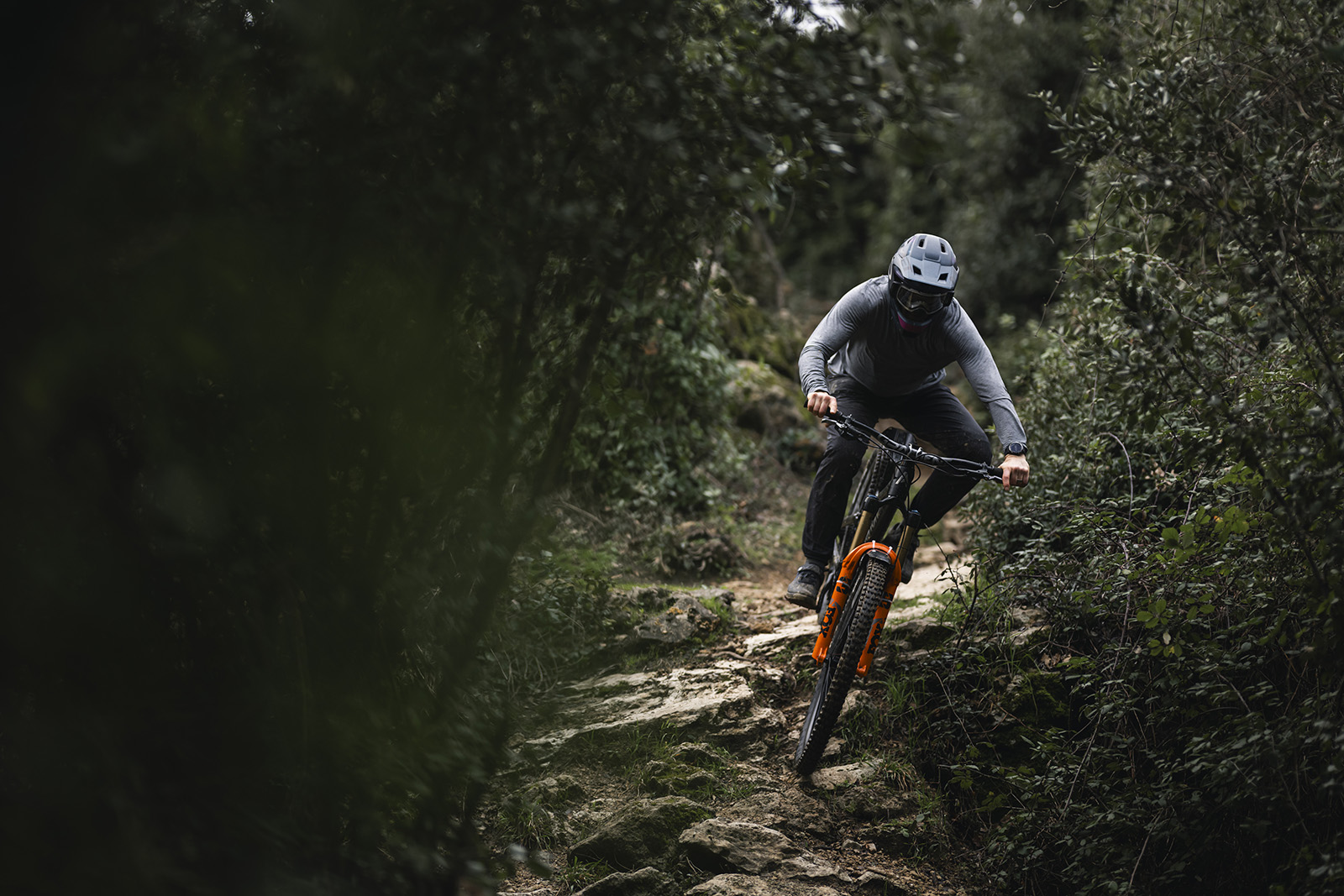 Male rider in grey top riding the Atherton A.170.1 full suspension mountain bike