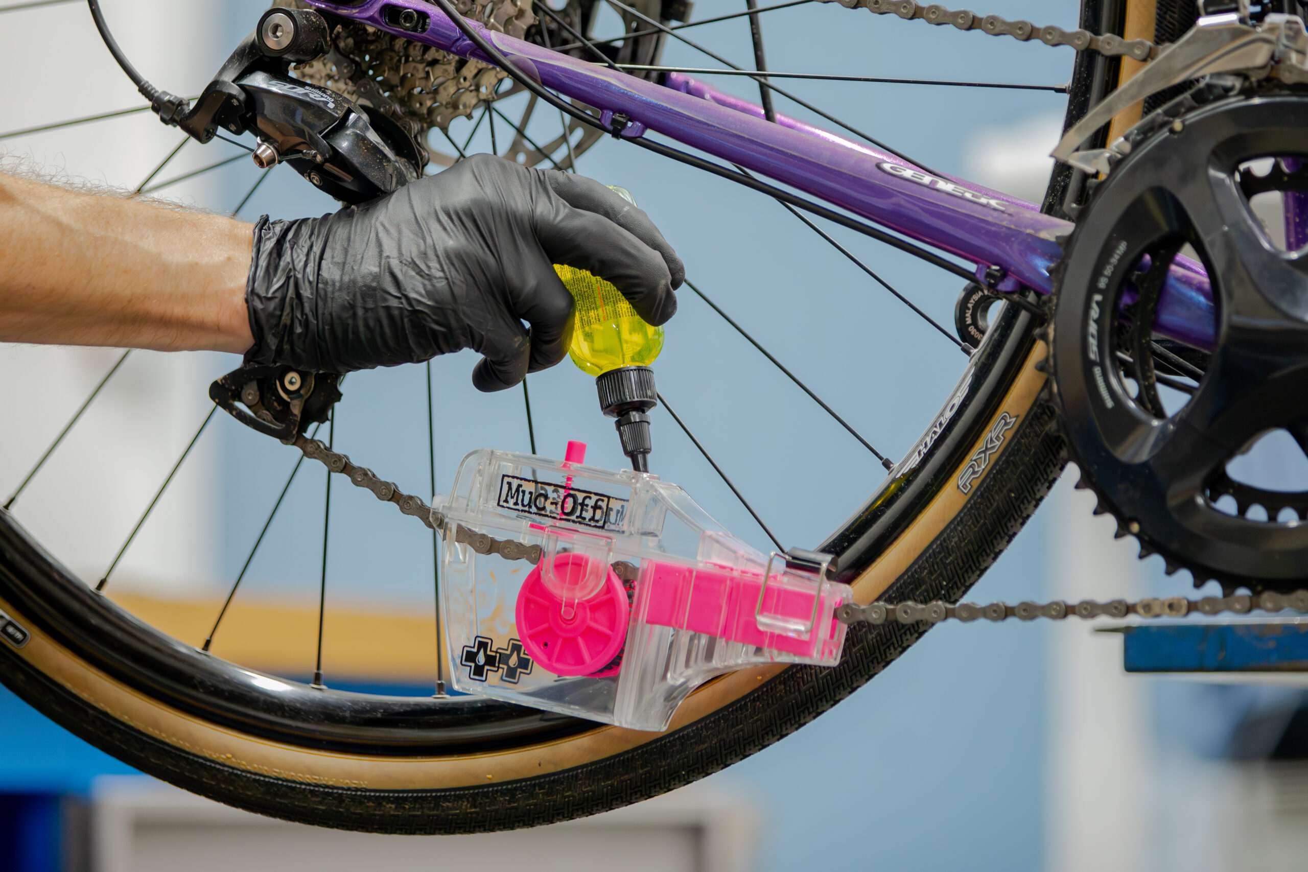 Will Soffe cleaning a road bike chain