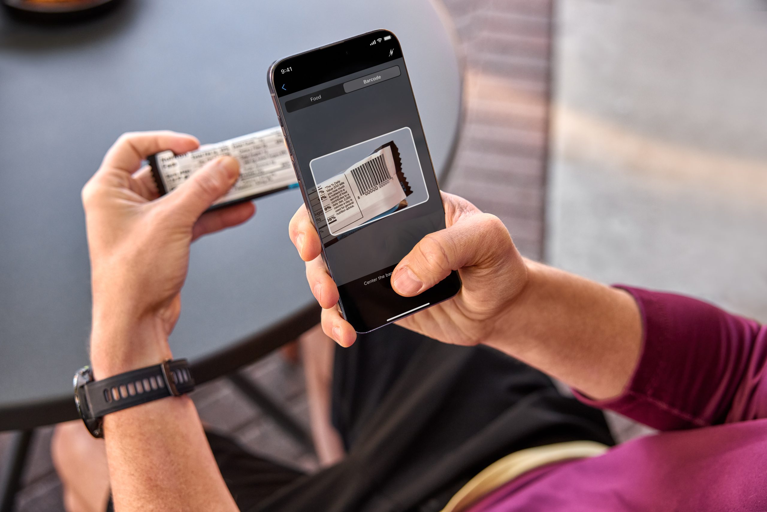 Person scanning food barcode on phone.