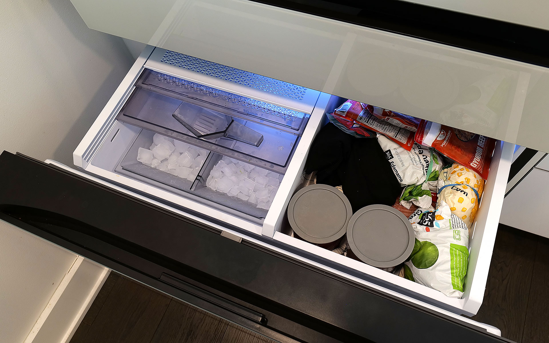 The top shelf in the freezer also contains the ice maker, which comes with an included scoop and the ability to make two difference kinds of cubes. 