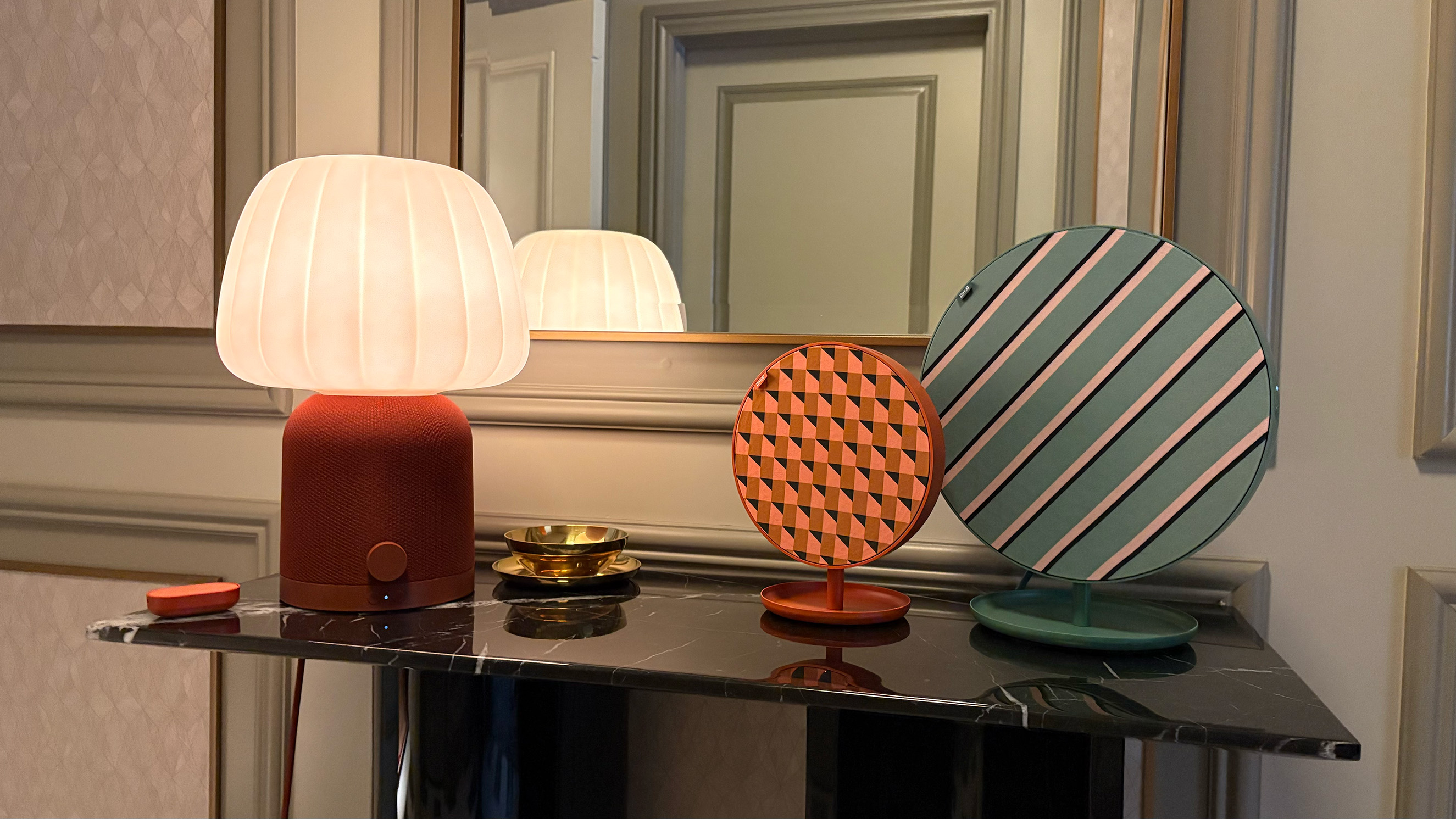 Lamps and speakers from the TEKLAN smart home collection.