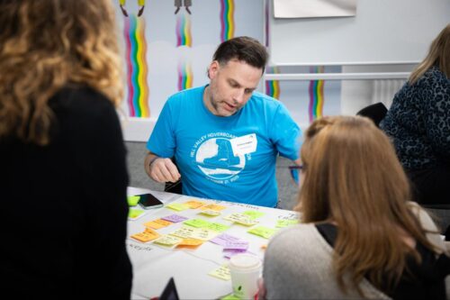 Educators sharing ideas around a table.
