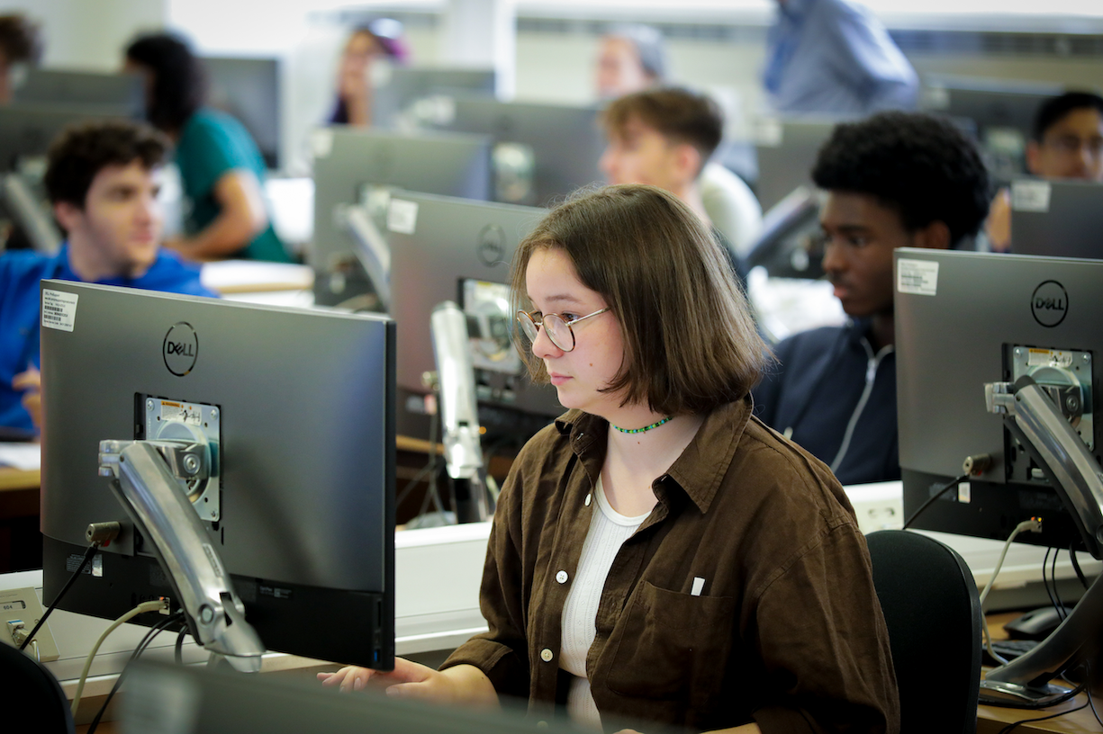 A teenager learning computer science.