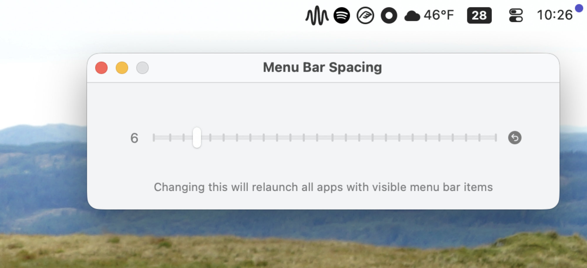 The application Menu Bar Spacing. It's a simple slider, allowing you to adjust the spacing between icons. Above the window are some menu bar icons that are squished together.