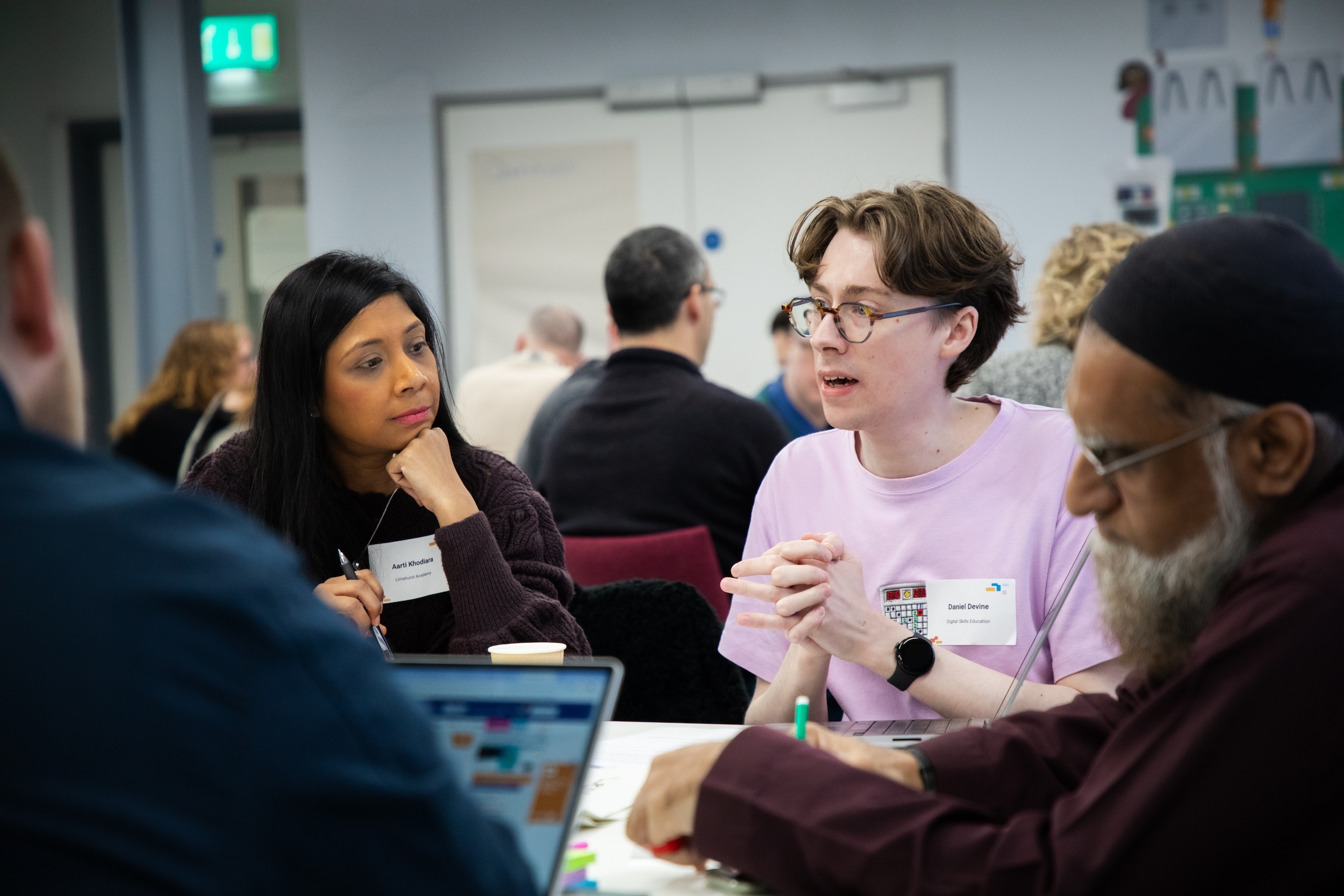 Photo of educators sharing ideas in a classroom.