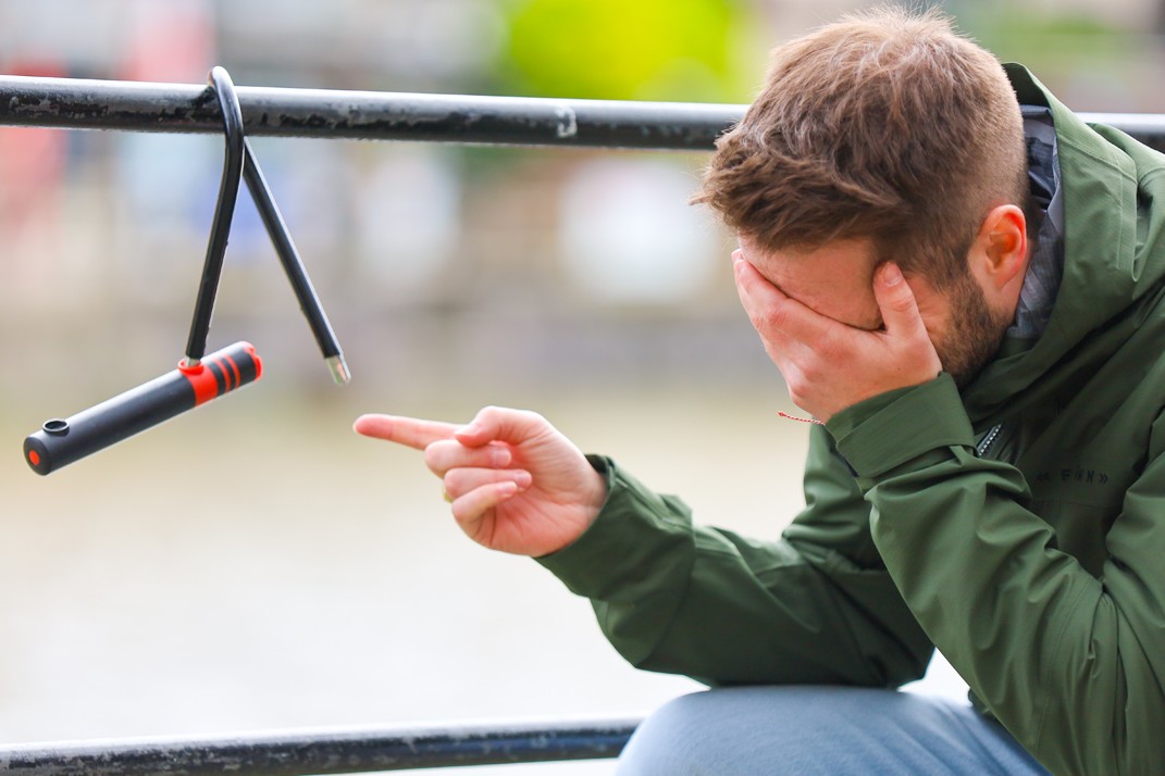 Cyclist in despair upon finding out that their bike has been stolen
