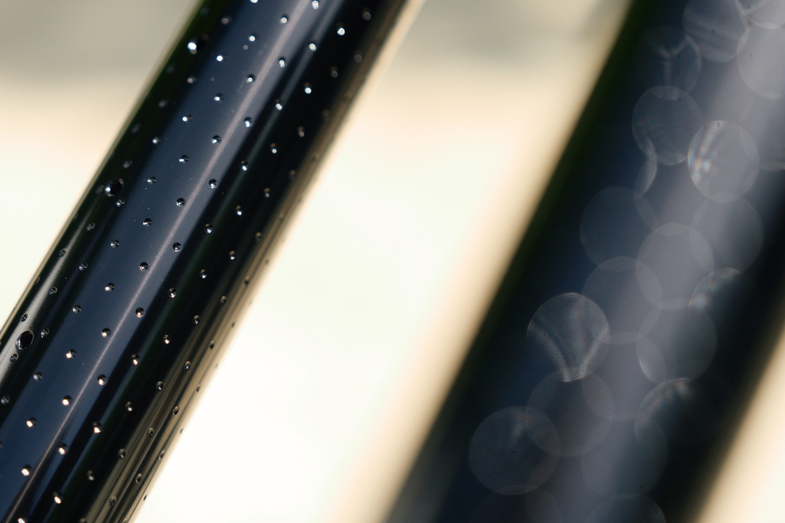 Close up photo showing the small divots dotted around the stanchions of the RockShox Boxxer, dubbed ButterWagonTech.