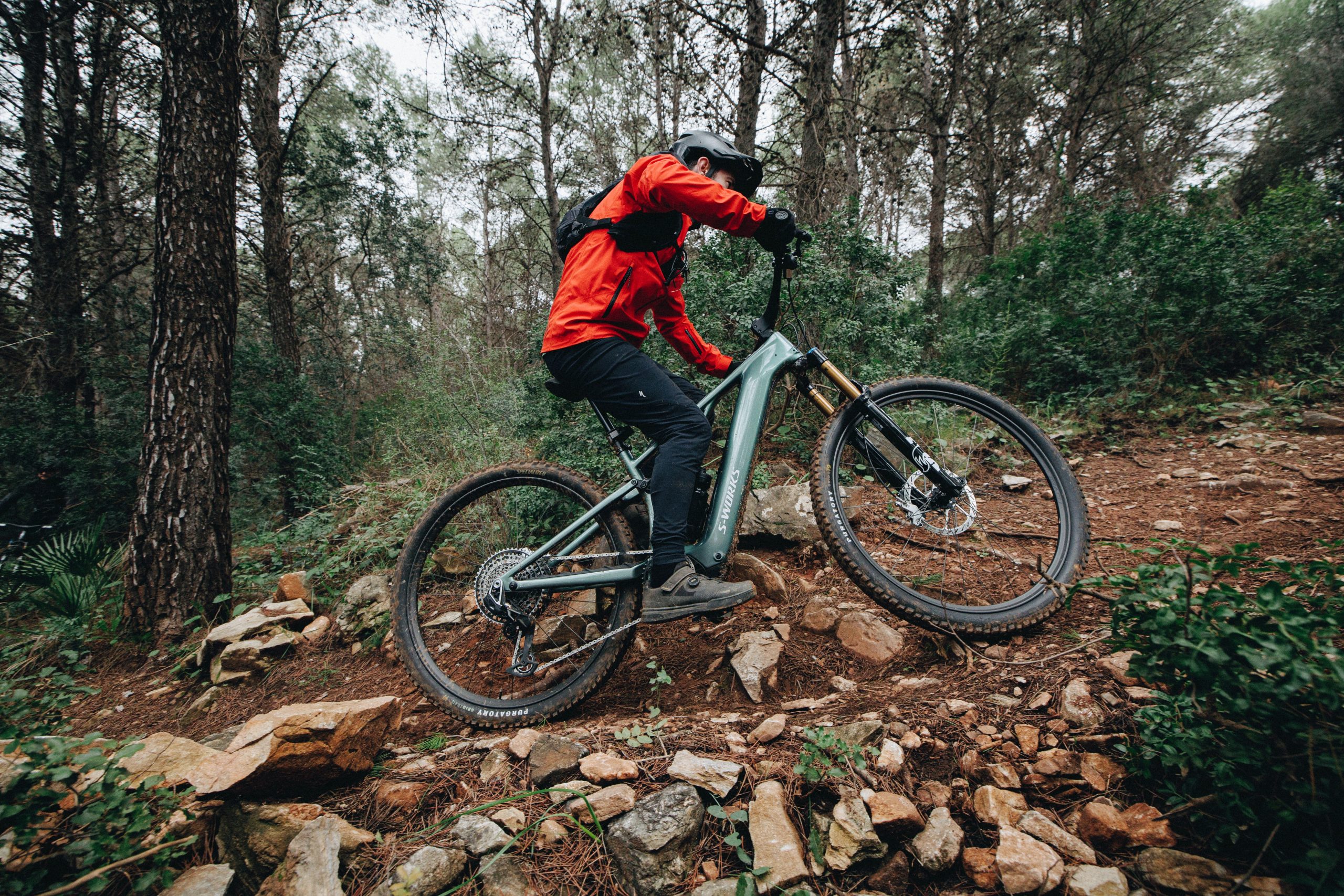 Specialized Levo R S-Works eMTB with Rob Weaver riding an uphill corner.