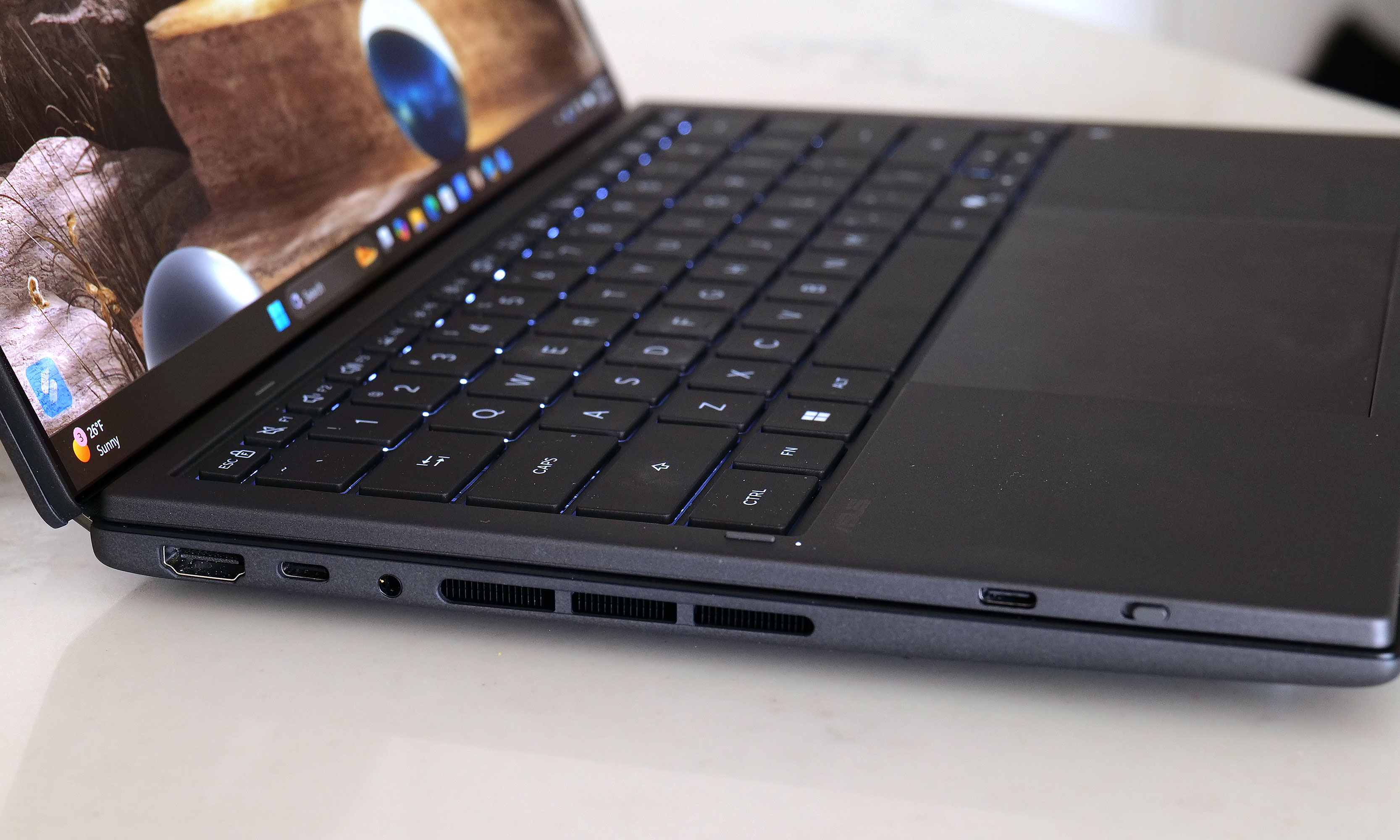 The left side of the Zenbook Duo features a full-size HDMI connector along with a USB-C port, plus a backup USB-C jack for charging the detachable keyboard. 
