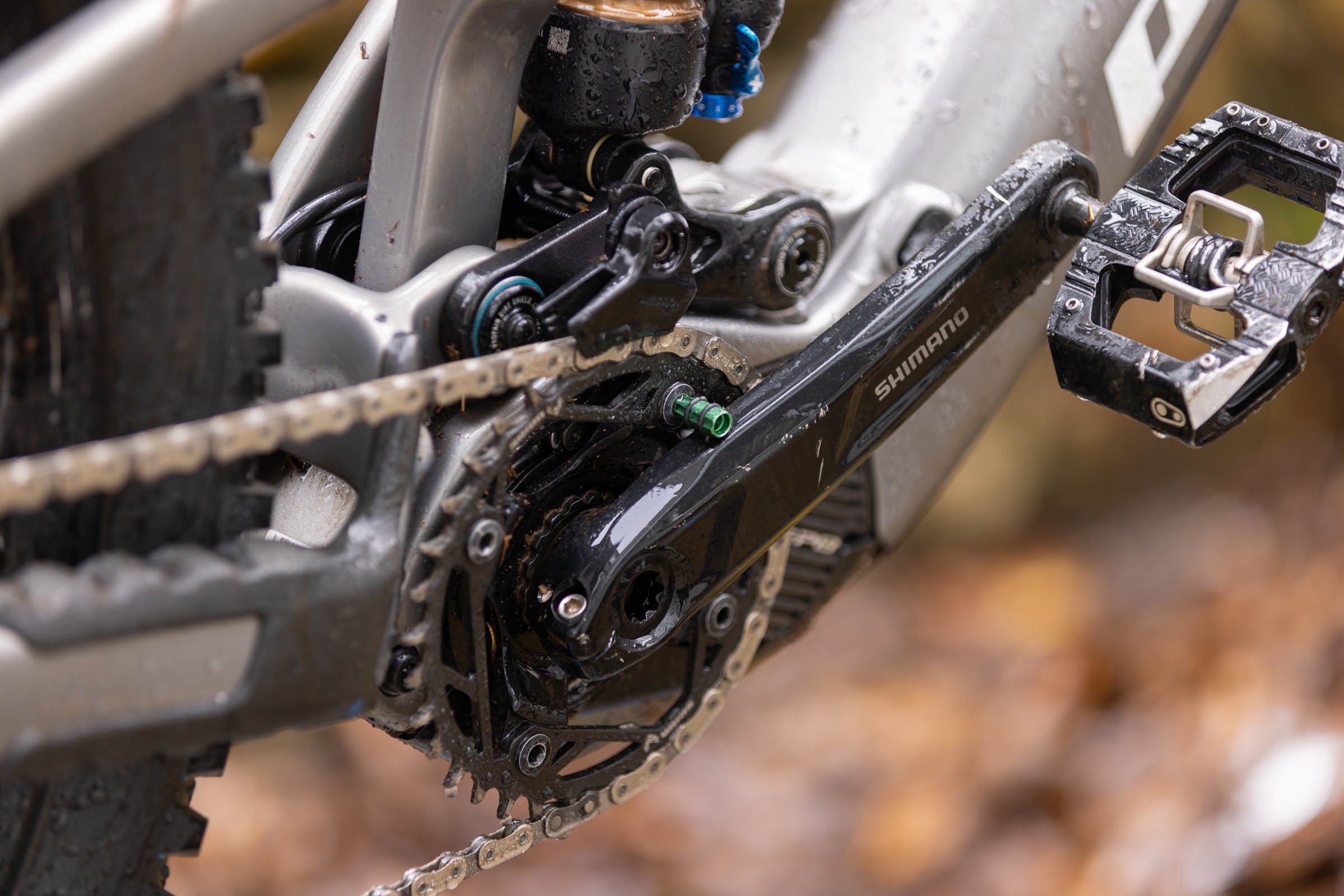 Peaty's Holeshot Fast Flow eMTB valve cap inserted into chainring bolt, with the cranks rotating backwards and butting up against it.