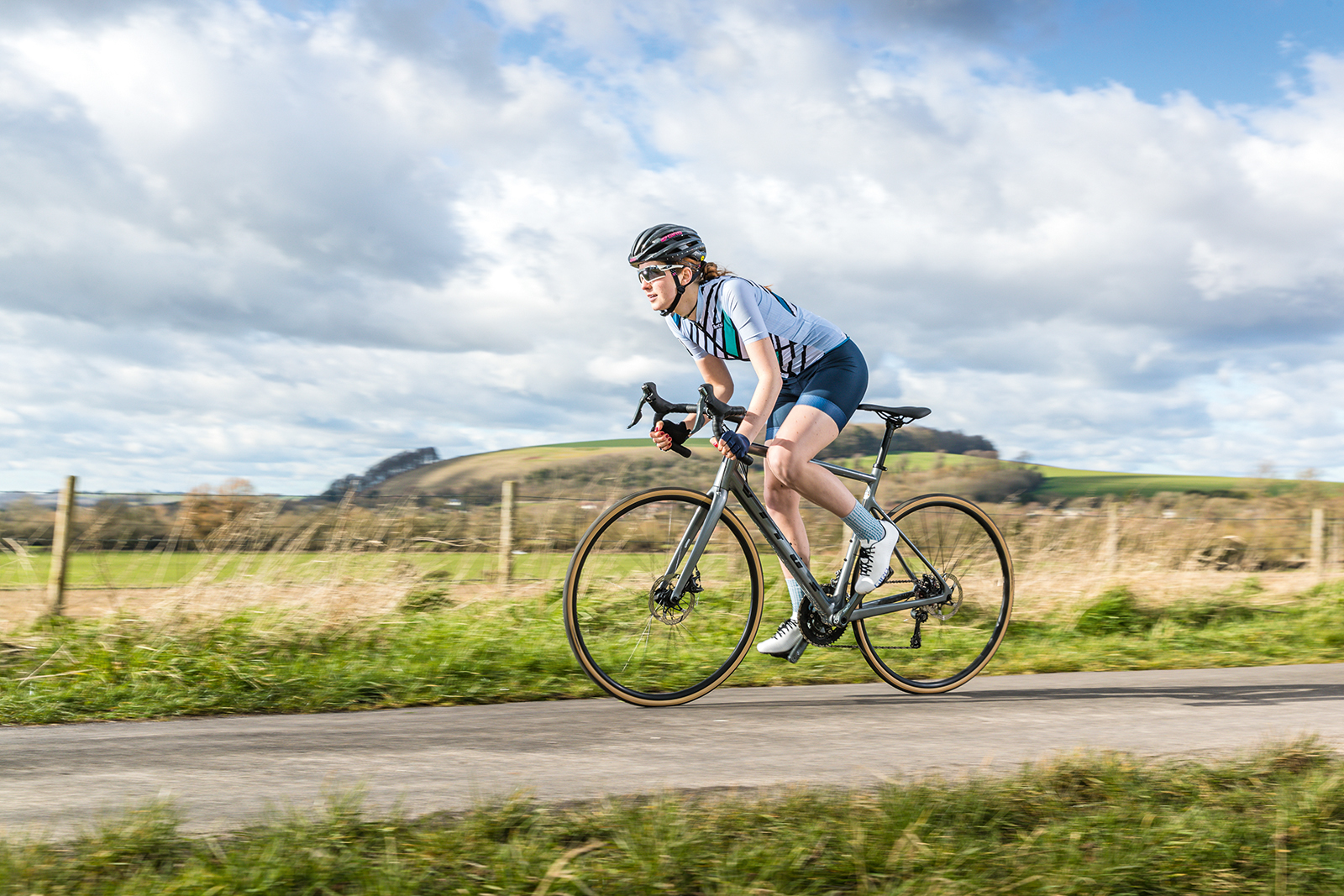 Female cyclist riding the Vitus Zenium Tiagra road bike