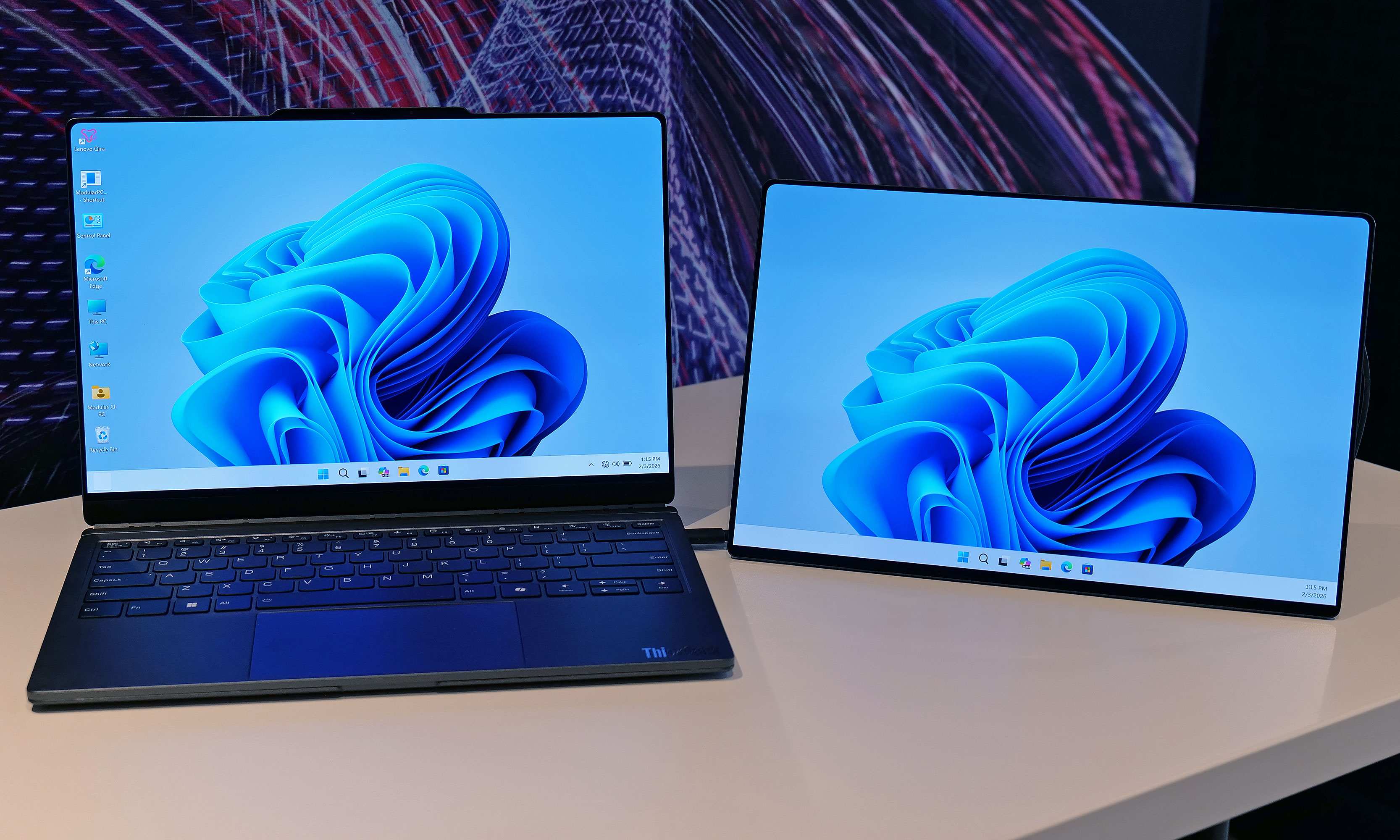 The Lenovo Modular AI PC concept's second screen can be attached to its lid or moved off to the side like a traditional dual monitor setup.